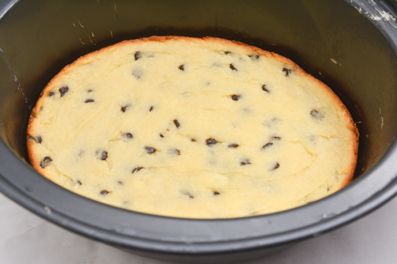 a cake cooking in a slow cooker