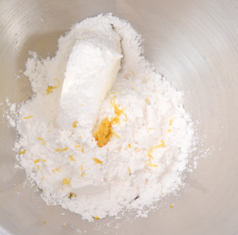 ingredients to make frosting in a bowl