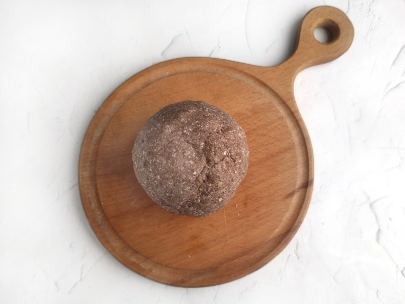 a ball of dough on a cutting board